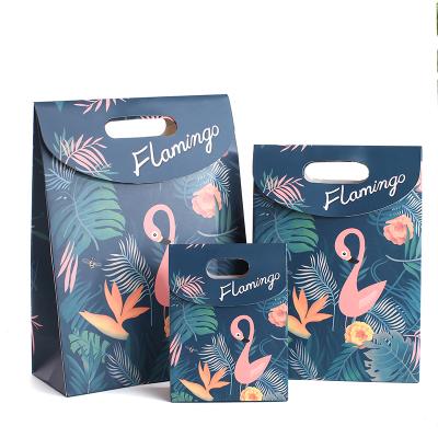 China Recycled Materials Birthday Festival Gift Packaging Bag Flamingo Paper Gift Bag With Punch Hole Handle for sale