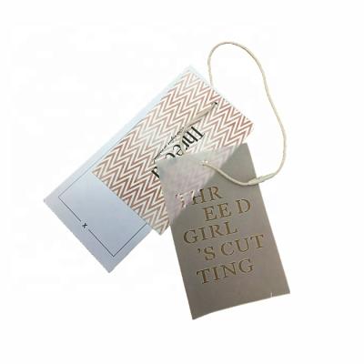 China Custom Hangtag Die Cut Recyclable Printing Paper Tissue Hangtags With Organic Cotton Handle for sale