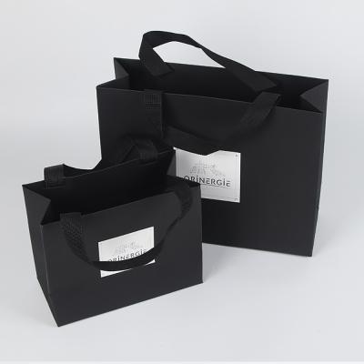 China Wholesale Recyclable Embossing Luxury Shopping Gift Black Customized Packaging Paper Bag With Cotton Handle for sale