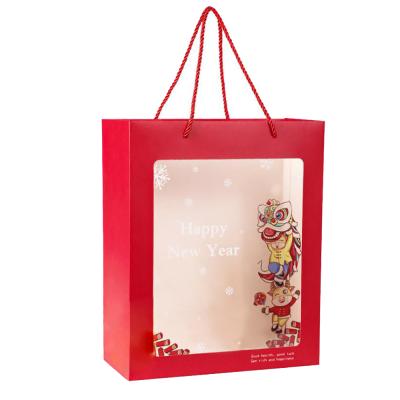 China Recycled Shopping Materials Product Promotional Square Logo Christmas Gift Custom Paper Bags With Rope Handle for sale