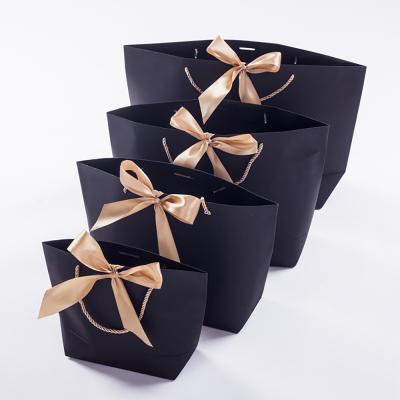 China Recycled Materials Wholesale Custom Luxury Black Wedding Party Gift Shopping Packaging Paper Bags With Your Own Logo for sale