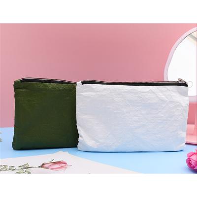 China Dupont Paper Makeup Bag Large Capacity Portable Pen Bag Tearproof Durable Washable Storage Waterproof Hand Wash Bag for sale