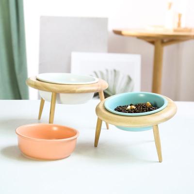 China High Quality Non-automatic Fashionable Items Designer Style Cat Feeders Artistic Raised Round Bowl Raised Pet Food Bowl With Wooden Feet for sale