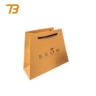 China China factory low cost recyclable custom brand craft foldable kraft paper shopping bags for sale