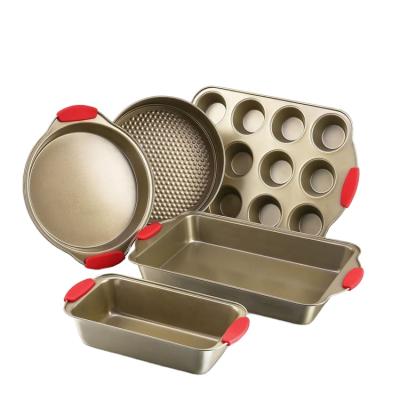 China 5 Piece Disposable Gold Nonstick Bakeware Set With Red Silicone Grip Handles for sale