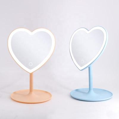 China 2023 Lighted Hand Mirror Plastic Tabletop Heart Shape Custom Makeup Cosmetic Heart Logo Portable Mirror for sale