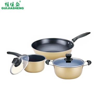 China Metal Gold Color Cookware Sets 16/22/32 cm Kitchen Non Stick Pot and Pan Set Iron Frying Wok with Glass Lid Customized Logo Box for sale