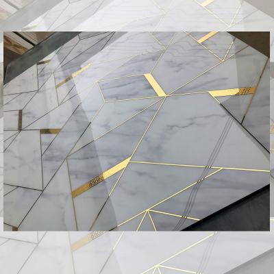 China Springletile modern Foshan porcelain polished indoor waterjet marble glazed backsplash tiles white and gold living room wall decoration for sale