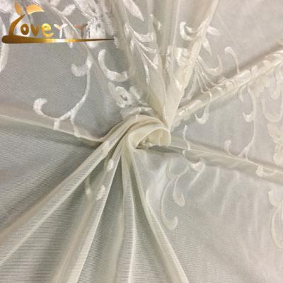 China Flame Retardant Turkey Polyester Tulled Fabric Environmental Beads Jacquard Tulle Fabric for sale