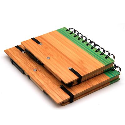 China Good quality spiral wholesale custom cover wooden notebook with pen for sale