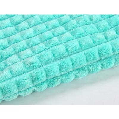 China 2021 breathable hot sale plain polyester embossed solid flannel fabric cuddle plush fabric for baby blanket for sale