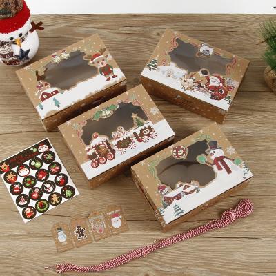 China 12 PCS Christmas kraft paper candy box pvc window human-shaped gingerbread gift Christmas cookie folding packaging box for sale