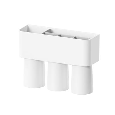 China Simple Magnetic Suction Bathroom Storage Set With Cup Multifunctional Toothbrush Holder Wall Travel Toothbrush Holder for sale