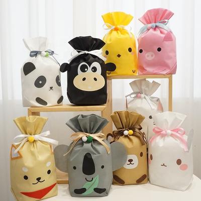 China Present Colored Cute Cute Dog Pattern Drawstring Pouch Baby Eco Birthday Gift Non Woven Gift Wrapping Bags for sale