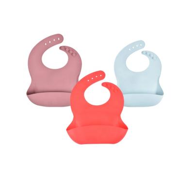 China Food Grade Washable White Drool Bib With Catcher Collapsible Waterproof Silicone Baby Snap Bibs for sale