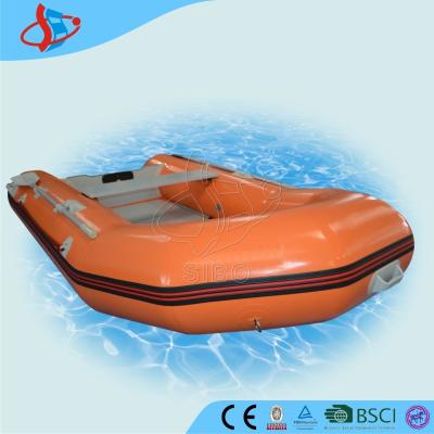 China Orange Towable Pvc Inflatable Boats Wood Bottom For Water Games for sale