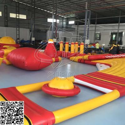 China Rojo/amarillo la flotación del agua inflable parquea el equipo de los juguetes del agua de la diversión en venta