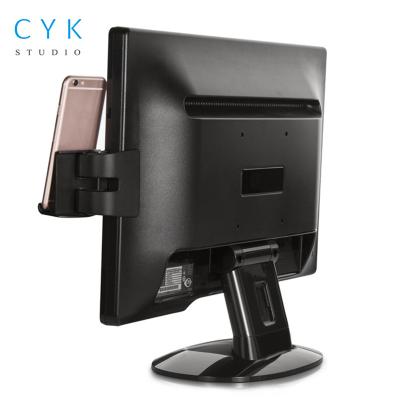 China Adjustable Side Mount Clip On Monitor Desktop Phone Silicon Plastic Holder For Smart Phone Holder for sale