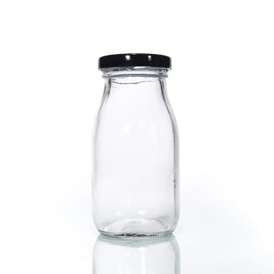 China wholesale produced packaging bottle respectful of factory round shape milk glass orders for sale