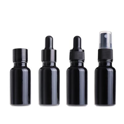 China Best Selling Recyclable Black Color 15ml 20ml Essential Oil Cosmetic Glass Bottle With Dropper for sale