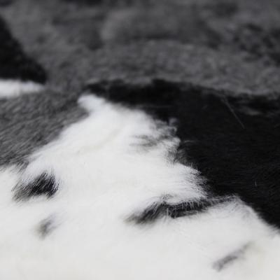 China Anthracnose faux cow fur custom color soft plush warp knitted artificialia faux fur custom fabric for home for sale