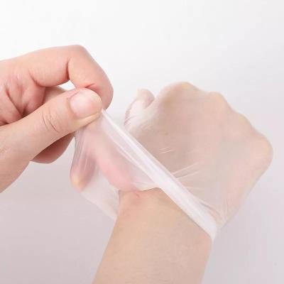 China Disposable Glove Factory Price Adult Antistatic Plastic Glove Strip Gloves For Kitchen Cleaning for sale