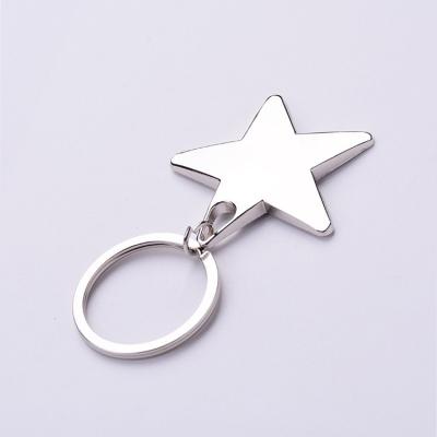 China Custom Souvenir Keychains Zinc Alloy Metal Five Headed Star Shaped Key Rings for sale