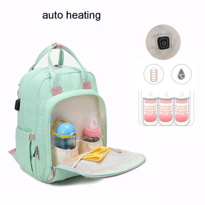 China Auto Heating Diaper Bag Backpack Maternity Maternity Maternal Mochilas Baby Product Usb Mom Dad Water Resistant Durable Care Travel for sale