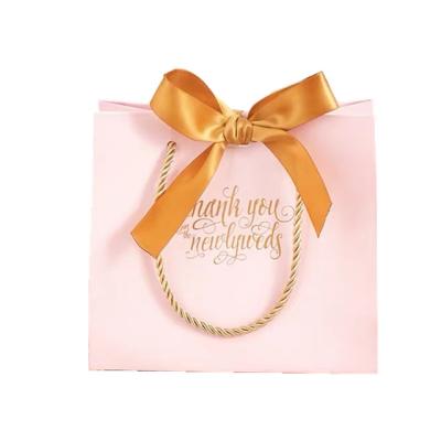 China BIODEGRADABLE Luxurious Christmas Gift Wrapping Pink Small Out Door Gift Paper Bag For Weddings for sale