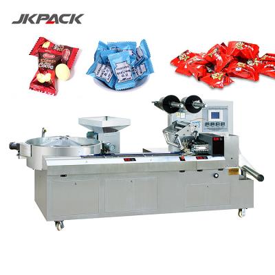 China Computer Controlled Praline Flow Candy Wrap Packaging Machine JY-1200/DXD-1200 for sale