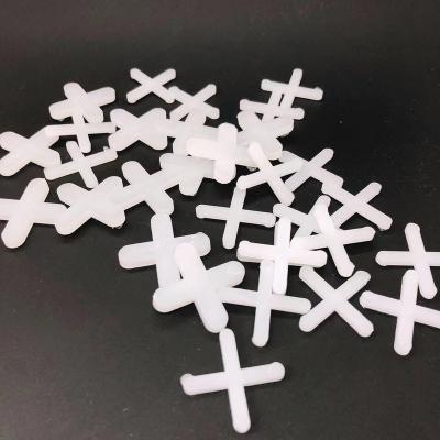 China 3mm Industrial Plastic 5mm Tile Leveling Clips Cross / Nail Clip Cross Tile Spacers for sale