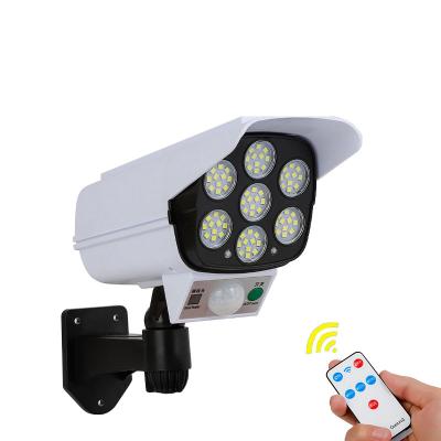 China Outdoor Motion Sensor Security Solar Light Dummy Camera Radio Outdoor LED Spotlight Waterproof 77 LED Lamp 3 Mode For Garden for sale