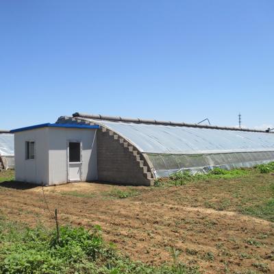 China Stable Structure Easily Assembled Hot Galvanized Steel Commercial Passive Solar Power Greenhouse With 5cm Heat Insulation Panel for sale