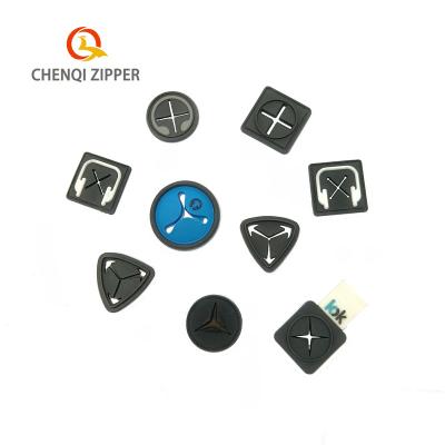 China Other Customized 2d 3d die cut pvc rubber logo earphone hole label for clothing bags for sale