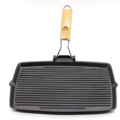 China Hot Selling Traditional Amazon Cast Iron Grill Casserole With Folding Wooden Handle for sale