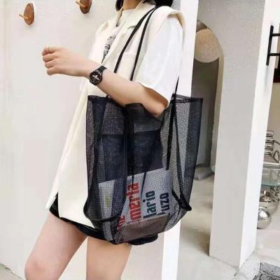 China Wholesale custom luxury ladies fashion logo women's shoulder bag hollow mesh summer beach casual beach tote shopping bag large capacity for sale