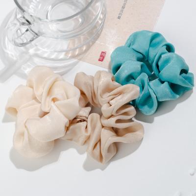 China Solid Color Creative Soft Travel Decoration Hair Scrunchies Small Hair Band Cloth Elastic Hair Band For Girls for sale