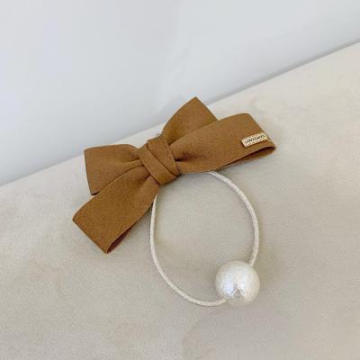 China New Simple Attractive Solid Color Design Bow Tie Pearl Hair Rope Girl Gift Hair Accessories Hair Tie for sale