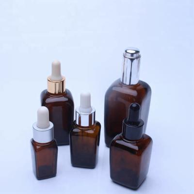 China Personal Care Square Amber Glass Bottles For Essential Oil for sale