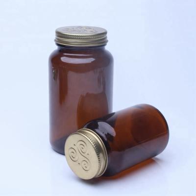 China Pharmaceutical Wide Neck Amber Glass Pharmaceutical Capsule Bottles With Metal Lid for sale