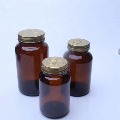 China 120ml/150ml/200ml Amber Glass Jars With Metal Pharmaceutical Screw Caps for sale