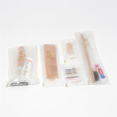 China Customized Biodegradable Hotel Supplies Amenities Kit Wholesale 5 Star Disposable Hotel Toiletries Set for sale