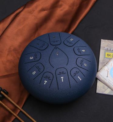 China Hotsale 12 Inch 12 Notes Tongue Drum Musical Instrument C D F Steel Tone Meditation Handpan for sale