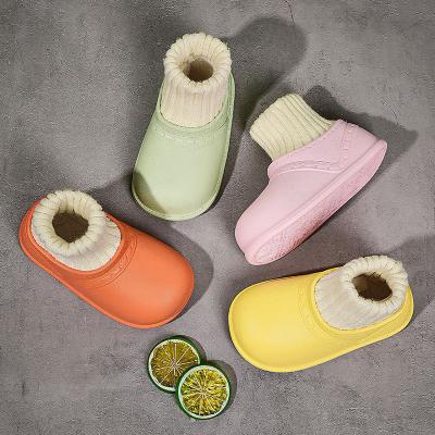 China Autumn Winter Solid Color EVA Shoes Light Weight Inside Sock Casual Flat Baby Soft-soled Warm Round Kid Waterproof Slippers for sale