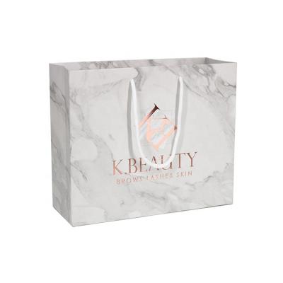 China Recyclable Customized Boutique Logo Printing Rose Gold Paper Shopping Bags for sale