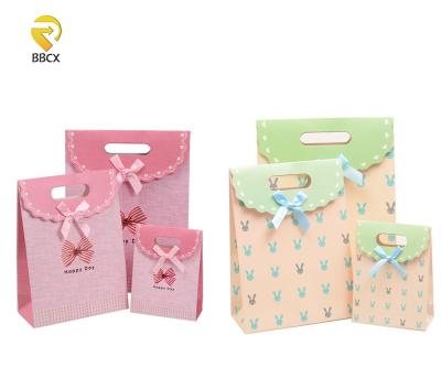 China New Year Environmental Friendly Portable Gift Box Paper Candy Bag Paper Gift Box Recyclable Materials Packaging Paper Box for sale