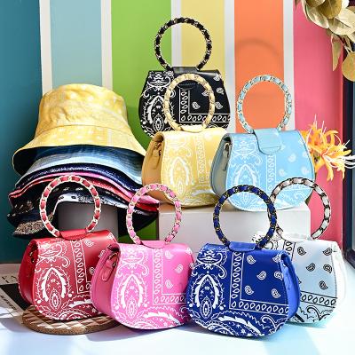 China 2021 summer high quality spot women's bag cashew flower round bag hat suit portable diagonal chain for sale