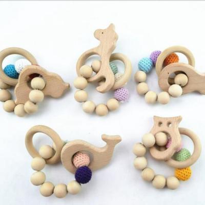 China Eco-Friendly Beech Wood Teeth Ring Beech Wood Sensory Rattle Toys Silicone Bracelet Teether for sale