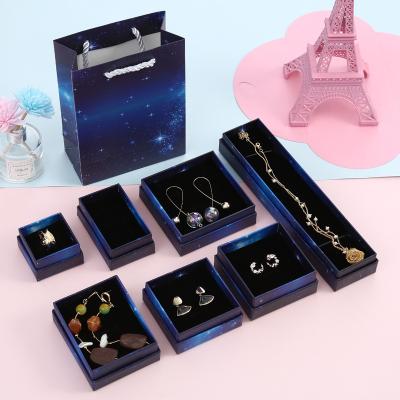 China Ornament Packaging Box Custom Fashion Cardboard Necklace Earring Dark Blue Star Printing Jewelry Box With Sponge for sale