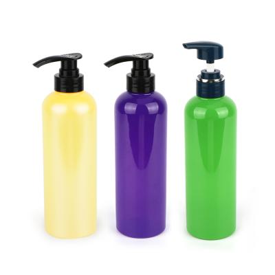 China Customized Recyclable Green 500ml Pet Lotion Shampoo Bottle Purple Pump for sale